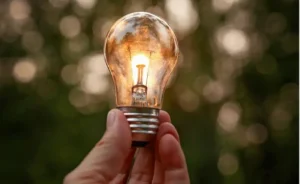 hand holding light bulb